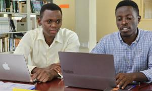 Derrick Wanda, a library staff member, sensitizing a Busitema University student on scholarly networks such as ORCID, Academia.edu, and Google Scholar during Day 2 of the International Open Access Week celebrations at the Faculty of Engineering Library, Busitema University, on 21st October 2025.