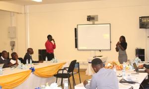 Ayella Patrick Ojok and Nyawere Hedwig students at Buistema University present a mobile app concept that helps farmers identify crop nutrient deficiencies by taking a photo of the plant. This session was held at the Faculty of Engineering Library during the Open Access Week celebrations on 20th October 2025.