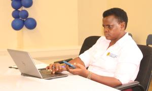 Dr. Fulgensia Kamugisha Mbabazi, Acting Deputy Chief of Graduate Studies, Research and Innovation, takes part in the vibrant Open Access Week celebrations at the Faculty of Engineering Library on 20th October 2025